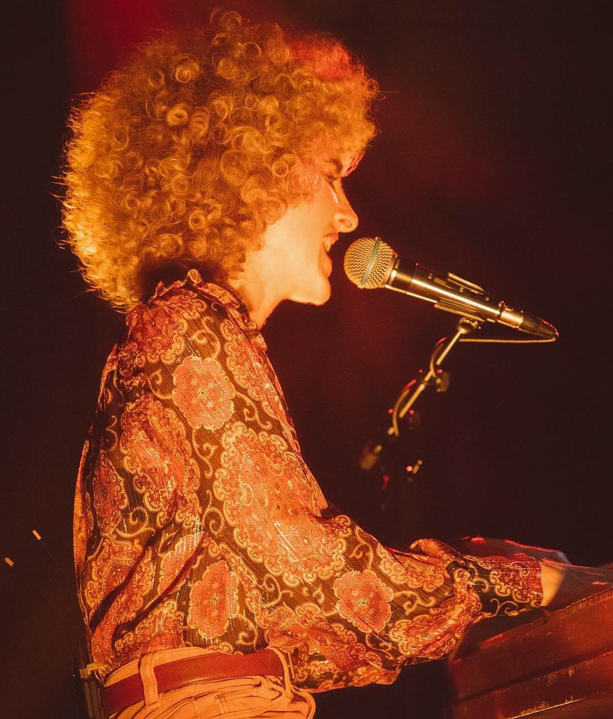 Tennis performing on stage, photographed by Joey Guzzino